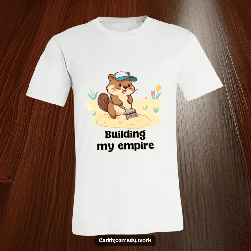 Funny t-shirt with a diligent beaver character meticulously raking a sand trap, showcasing golf course maintenance.